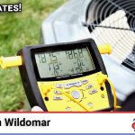 Technician performing AC repair service in Wildomar, CA