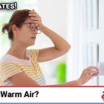 Technician diagnosing a central air conditioner that's running but blowing warm air instead of cold air in a Southern California home